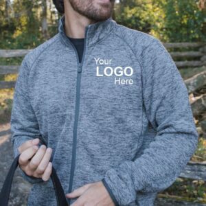 A man outdoors in a stylish full-zip sweater on a crisp spring day, featuring a left-chest imprint that says 'Your Logo Here